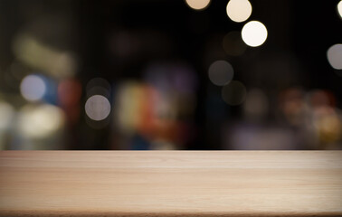 Empty wood table top and blur of out door garden background Empty wooden table space for text...