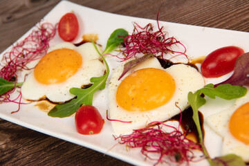 RECIPE FOR FRIED EGGS AND POMEGRANATE MOLASSES CUT INTO HEARTS, STARS AND FLOWERS. High quality photo