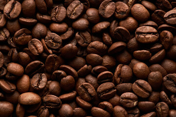 Macro image of delicious roasted coffee beans, food texture background