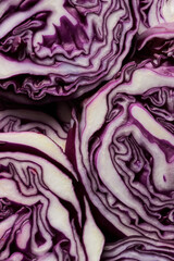 Fototapeta premium Food background of red cabbage slices in abstract texture pattern