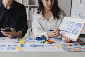 Business teamwork and working with UX developer and UI designer at table in modern office. Creative and development agency concept.