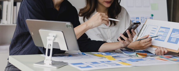 Business teamwork and working with UX developer and UI designer at table in modern office. Creative and development agency concept.