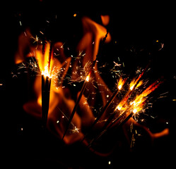sparkler sparklers on a background of flames.