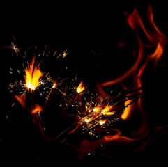 sparkler sparklers on a background of flames.