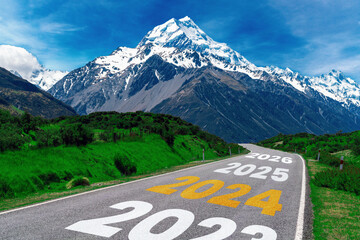 2024 New Year road trip travel and future vision concept . Nature landscape with highway road...