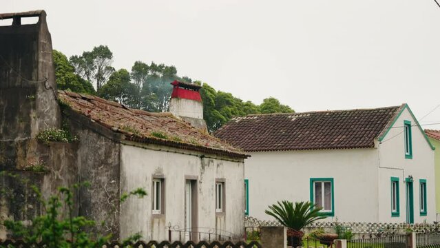 Static shot of white old house facade. Old exterior house. Abandoned building.  Autumn vibes. Rural landscape. smoke coming out of fireplace.