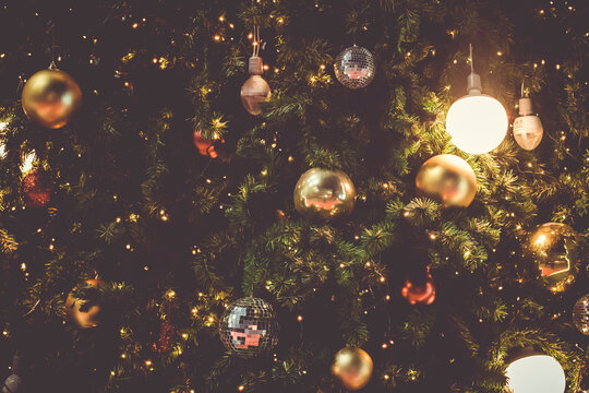 Christmas Red Ball Hanging on a Fir Tree Branch © Parichart