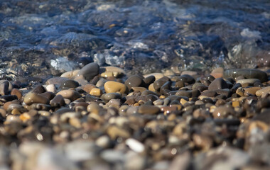 Landscape on the seashore ,pebbles with calm waves