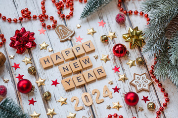 A postcard or banner.A symbol from the number 2024 with red Christmas tree toys, stars, sequins and...
