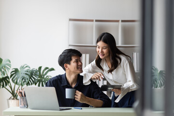 Technology and financial advisory services concept. Business teamwork and working on digital laptop computer with advisor showing plan of investment to clients at table office. Digital marketing.