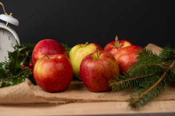 apples on wooden table.Apples on a wooden background. apples for apple pie, pine branches and apples