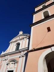 Fototapeta premium Ancient Christian Catholic church against the blue sky
