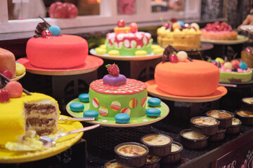 The dessert counter glows with an array of confectionery, inviting indulgence. These delights challenge the modern push for sugar reduction.