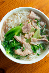 top view rice noodles with pork and cabbage at vertical composition