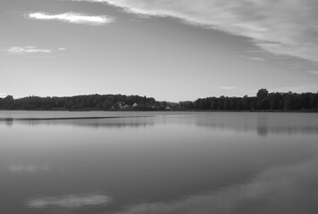 River forest horizon landscape background,black and white Atmospheric reflection of trees on the lake