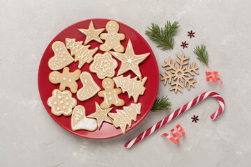 Cute homemade Christmas cookies with decor on concrete background,top view