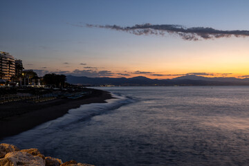 View from Torremolinos towards Malaga just before sunrise. Costa del Sol, Spain.