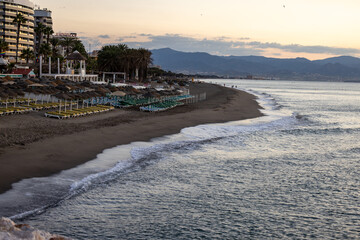 View of Bajondillo Beach in Torremolinos at sunrise. Costa del Sol, Spain.