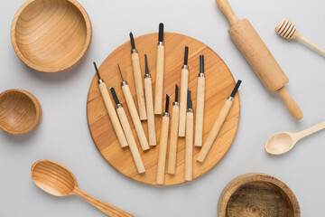Carpenter tools with wooden objects on color background ,top view