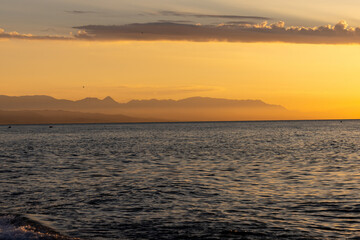 View from Torremolinos towards Malaga at sunrise. Costa del Sol, Spain.