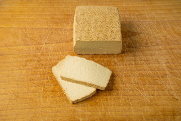 Tofu Cheese Isolated, Smoked Vegan Cheese Slice, Sliced Soya Bean Curd, Soy Protein or TSP