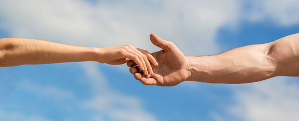 Solidarity, compassion, and charity, rescue. Hands of man and woman reaching to each other,...