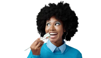 Foto op Canvas Sushi, happy and face of black woman with seafood on isolated, png and transparent background. Eating, hungry and African person with chopsticks for luxury takeout for lunch, dinner and supper © Suresh/peopleimages.com