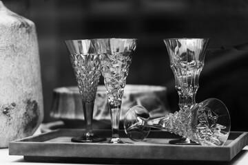 Monochrome photo of crystal glasses. Glasses on the background,Crystal glass 