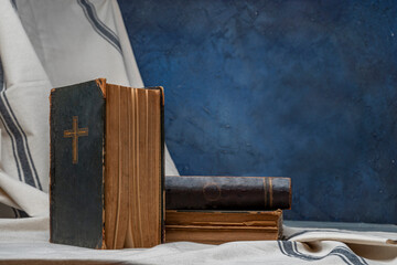 Old book Holy Bible. Cross on a dark cover. Sacred scripture, that contains the word of God....