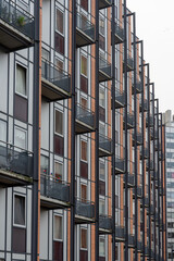 Fototapeta premium Modern apartment building.Sheet metal cladding, building with metal balconies,