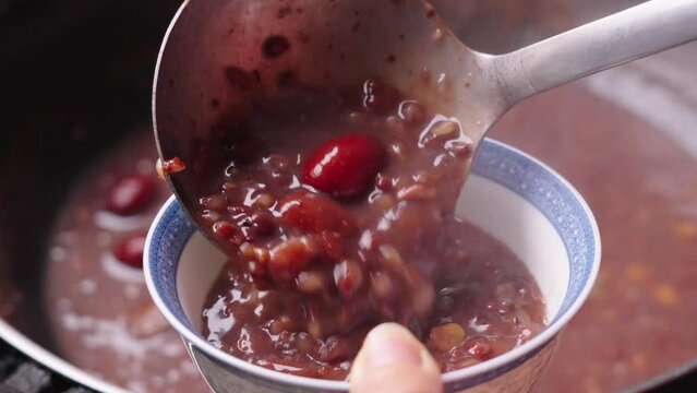boiled red rice porridge with beans and jujubes. traditional food Laba porridge.