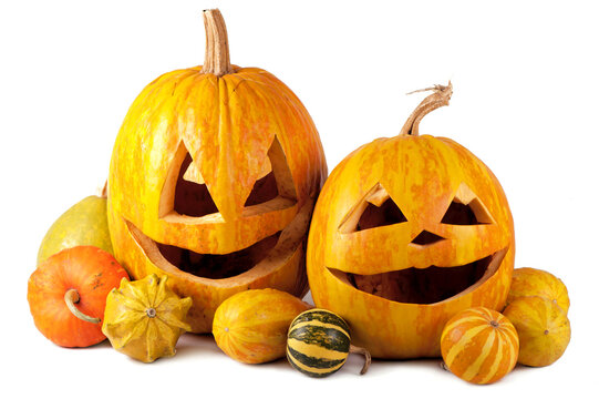 Scary Halloween pumpkins isolated on a white background. Scary glowing faces trick or treat