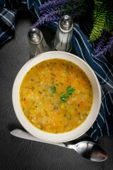 Barley soup with vegetables and chicken.