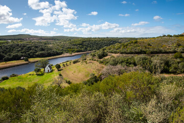 Naklejka premium still bay river valley a Mediterranean landscape of rolling hills and dry stone walls