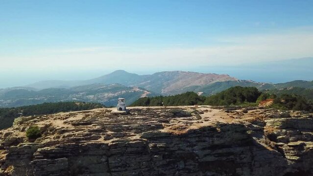 Aerial landscape seen from the drone of the Ipsarion or Ypsarion mountain in Thassos , Greece , the highest mountain of the island with Mediterranean specific vegetation , pines and shrubs 