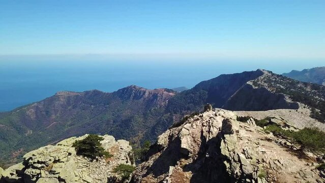 Aerial landscape seen from the drone of the Ipsarion or Ypsarion mountain in Thassos , Greece , the highest mountain of the island with Mediterranean specific vegetation , pines and shrubs