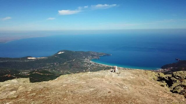 Aerial landscape seen from the drone of the Ipsarion or Ypsarion mountain in Thassos , Greece , the highest mountain of the island with Mediterranean specific vegetation and the Aegean sea shore 