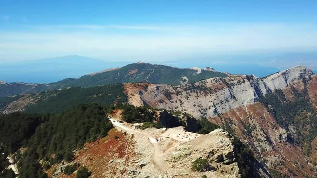 Aerial landscape seen from the drone of the Ipsarion or Ypsarion mountain in Thassos , Greece , the highest mountain of the island with Mediterranean specific vegetation , pines and shrubs