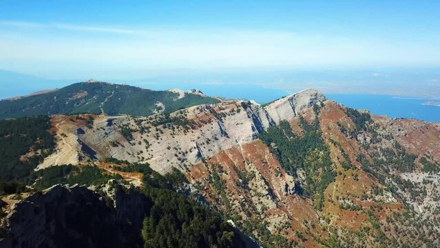 Aerial landscape seen from the drone of the Ipsarion or Ypsarion mountain in Thassos , Greece , the highest mountain of the island with Mediterranean specific vegetation , pines and shrubs and geologi