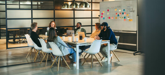 Team office meeting: Innovating solutions for software development in a tech company - Powered by Adobe