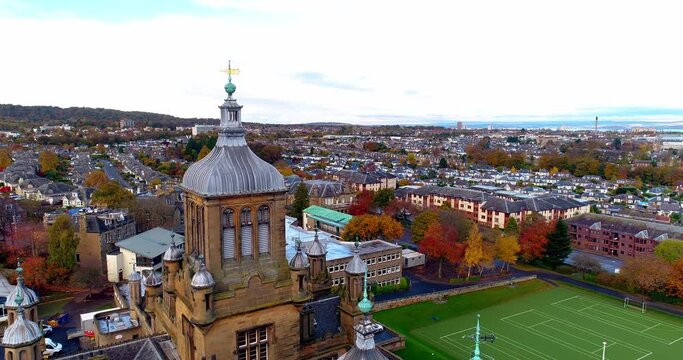 Aerial push in towards Davidson's mains in Edinburgh above Stewart's Melville College