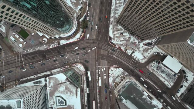 Cinematic Overhead Vehicle Traffic 4K Time lapse Winter Drone Shot Canadian Roadway Trans Highway One Intersection Portage Avenue and Main Street Capital City Downtown Winnipeg Manitoba Canada