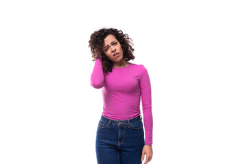 young caucasian woman with curly black hair on white background