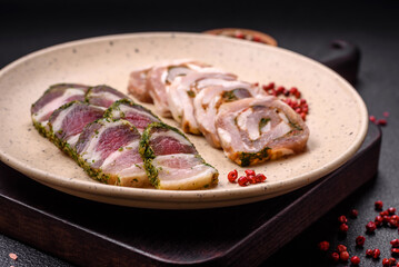 Delicious meatloaf with lard, salt, spices and herbs cut into slices