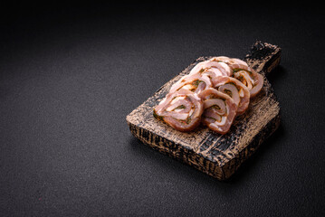 Delicious meatloaf with lard, salt, spices and herbs cut into slices