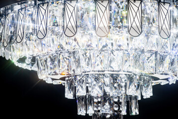 Chandelier, luxury modern style on dark background.