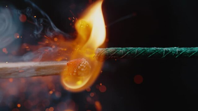 Close-Up View of a Match Lighting a Firework Fuse