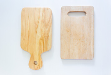 Two wooden cutting boards in top view, closed up shot on white background.