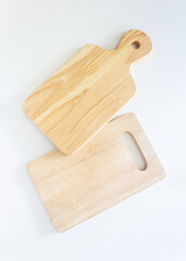 Pair of wooden cutting boards in top view, closed up shot on white background.