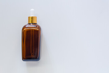 Empty beauty product bottle on white background with copy space. Mockup and product presentation.